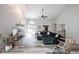 Bright living room with vaulted ceilings, fireplace, and stylish decor at 8023 Talliho Dr, Indianapolis, IN 46256