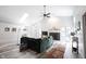 Bright living room with vaulted ceilings, fireplace, skylight, and modern decor at 8023 Talliho Dr, Indianapolis, IN 46256