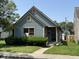 Charming blue bungalow home with a well-maintained lawn and inviting front entrance at 812 N California St, Indianapolis, IN 46202