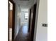 Hallway featuring wood flooring, doors and fresh paint, awaiting personal touches at 812 N California St, Indianapolis, IN 46202