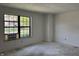 Spacious room featuring a window, and clean white walls at 812 N California St, Indianapolis, IN 46202