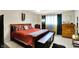 A bedroom featuring a large bed with colorful pillows and a decorative tapestry at 8121 Bromley Pl, Indianapolis, IN 46219