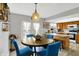 A well-lit dining room features modern light fixtures and a dining area at 8121 Bromley Pl, Indianapolis, IN 46219