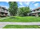 Well-maintained community grounds with lush green lawns, mature trees and sidewalks at 8121 Bromley Pl, Indianapolis, IN 46219