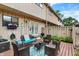 Private outdoor patio with a seating area, flower box and privacy fence at 8121 Bromley Pl, Indianapolis, IN 46219