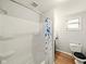 Clean and simple bathroom featuring a tub with shower and a toilet with a black lid at 813 Cottage Ave, Columbus, IN 47201