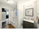Well-lit bathroom with a vanity, bathtub and shower, and modern fixtures at 813 Cottage Ave, Columbus, IN 47201
