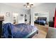 Spacious bedroom with a large mirror, a ceiling fan, and wood-style flooring at 813 Cottage Ave, Columbus, IN 47201