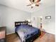Spacious bedroom featuring wood-style flooring, and a view into an adjacent bathroom at 813 Cottage Ave, Columbus, IN 47201