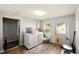 Bright laundry room with modern washer and dryer, a window, and neutral paint at 813 Cottage Ave, Columbus, IN 47201