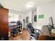 Bright office featuring wood floors, a large window, and ample storage space at 813 Cottage Ave, Columbus, IN 47201