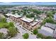 A high-angle aerial of the building showcasing the neighborhood, tree-lined streets and surrounding amenities at 855 N East N St # 104-B, Indianapolis, IN 46202