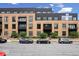 Modern building with brick exterior, balconies and street parking at 855 N East N St # 104-B, Indianapolis, IN 46202