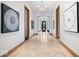 Hallway with wood floors in a herringbone pattern and modern art at 855 N East N St # 104-B, Indianapolis, IN 46202
