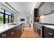 Open concept kitchen featuring stainless steel appliances, modern cabinets, and views to a living area at 855 N East N St # 104-B, Indianapolis, IN 46202