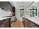 Modern kitchen with stainless steel appliances, stylish cabinets, and a functional layout at 855 N East N St # 104-B, Indianapolis, IN 46202