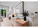 Bright living room with wood floors, a modern console table, and stylish decor at 855 N East N St # 104-B, Indianapolis, IN 46202