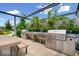 An outdoor kitchen area featuring stainless steel grills and countertops at 855 N East N St # 104-B, Indianapolis, IN 46202