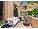 Relaxing outdoor patio area with a fire pit, comfortable seating, and privacy screen at 855 N East N St # 104-B, Indianapolis, IN 46202