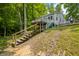 Charming home on a wooded lot, featuring multiple decks and stairs, perfect for nature lovers and outdoor living at 8576 Riser Dr, , IN 46164