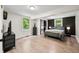Spacious bedroom with wood floors, closet, and large windows that let in natural light at 8576 Riser Dr, , IN 46164