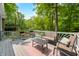Relaxing outdoor deck features stylish seating and wooded views at 8576 Riser Dr, , IN 46164