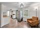 Well-lit kitchen with stainless steel appliances, white cabinets, and open access to the rest of the home at 8576 Riser Dr, , IN 46164