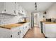 Bright kitchen features white cabinets, butcher block countertops, subway tile backsplash, and stainless steel appliances at 8576 Riser Dr, , IN 46164