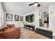 Cozy living room with modern flooring, a ceiling fan, and a TV above a sleek console at 8576 Riser Dr, , IN 46164