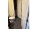 Compact toilet area with space for a washer and dryer, maximizing convenience in the home at 8926 Durban Ct, Indianapolis, IN 46234