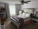 This charming bedroom features a decorative bed frame, ample natural light, and stylish furnishings at 8926 Durban Ct, Indianapolis, IN 46234