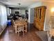 Open-concept dining area with hardwood floors, seamlessly connected to kitchen and living spaces at 8926 Durban Ct, Indianapolis, IN 46234