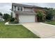 Charming two-story home with brick accents and a well-maintained lawn and front flower bed at 8926 Durban Ct, Indianapolis, IN 46234
