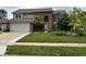 Charming two-story brick home with a well-manicured lawn and inviting curb appeal at 8926 Durban Ct, Indianapolis, IN 46234