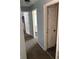 A bright hallway with several open doorways invites exploration and highlights the home's layout at 8926 Durban Ct, Indianapolis, IN 46234
