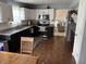 Updated kitchen featuring granite countertops, stainless steel appliances, and white subway tile backsplash at 8926 Durban Ct, Indianapolis, IN 46234