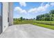 Expansive backyard featuring a spacious concrete patio and lush lawn with a view of the neighborhood at 9949 Nightsong Ln, Avon, IN 46123