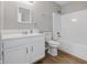 Bathroom with white cabinets, mirror, toilet and a shower/tub combo at 9949 Nightsong Ln, Avon, IN 46123