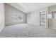 Bright bedroom with vaulted ceilings, neutral walls, carpet and a large window at 9949 Nightsong Ln, Avon, IN 46123