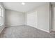 Spacious bedroom with neutral walls, carpeting, and a convenient closet at 9949 Nightsong Ln, Avon, IN 46123