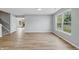 Bright dining room featuring wood-look floors, modern table setting, and natural lighting at 9949 Nightsong Ln, Avon, IN 46123