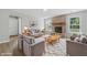 Bright living room featuring a brick fireplace, plush seating, and abundant natural light at 9949 Nightsong Ln, Avon, IN 46123