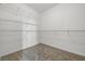 Well-organized walk-in closet with ample shelving and plush carpeting for storage at 9949 Nightsong Ln, Avon, IN 46123