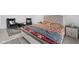 Large bedroom showcasing a bed with stylish patterns and a sitting area with modern furniture at 10118 Falls Canyon Ln, Indianapolis, IN 46229