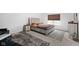 A spacious bedroom features a plush bed with a tufted headboard, offering a cozy and inviting atmosphere at 10118 Falls Canyon Ln, Indianapolis, IN 46229
