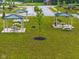 The community park features covered picnic tables and barbecue grills amidst a green lawn at 10118 Falls Canyon Ln, Indianapolis, IN 46229