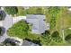 An aerial view presents the roof and backyard, nestled among lush greenery and a well manicured lawn at 10262 Carmine Dr, Noblesville, IN 46060