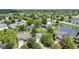 Aerial view showing the home’s location near a scenic pond, surrounded by lush trees and greenery at 10262 Carmine Dr, Noblesville, IN 46060