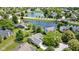 This aerial view shows the home's location, close to a large pond and lush greenery of the neighborhood at 10262 Carmine Dr, Noblesville, IN 46060
