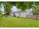 Picturesque backyard featuring a patio with outdoor seating and a well-maintained lawn at 10262 Carmine Dr, Noblesville, IN 46060